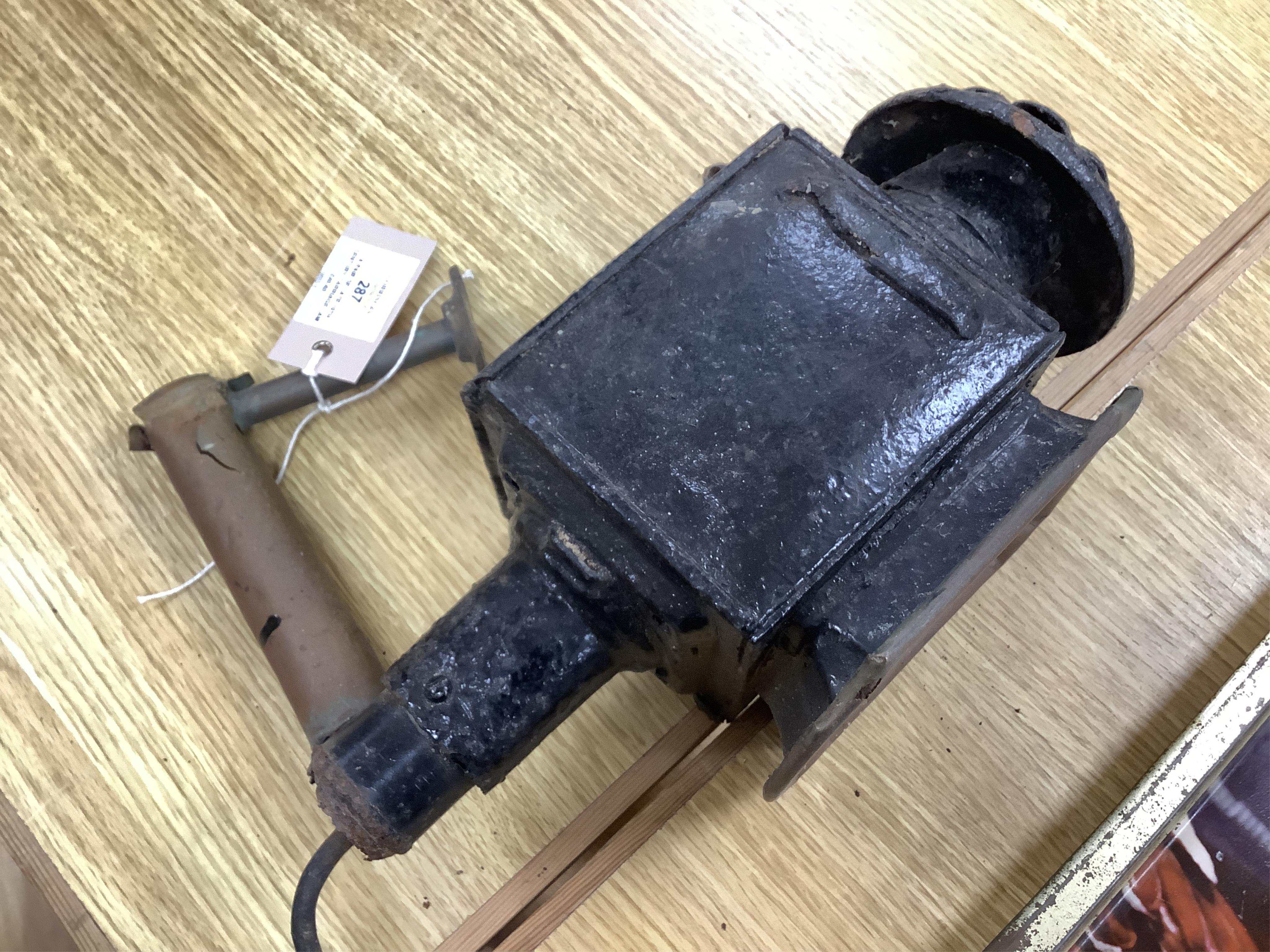 A pair of late 19th century carriage lamps and another